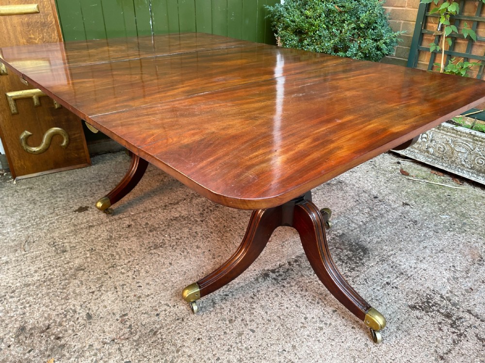 Early C19th Regency period mahogany twin-pillar dining table . View XV