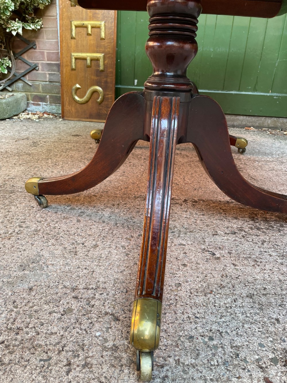 Early C19th Regency period mahogany twin-pillar dining table . View XVI