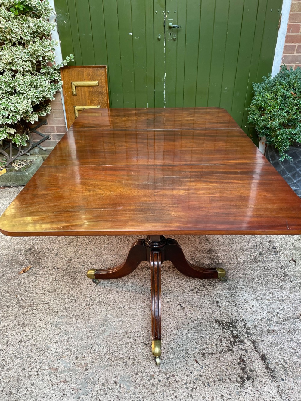 Early C19th Regency period mahogany twin-pillar dining table . View XXI