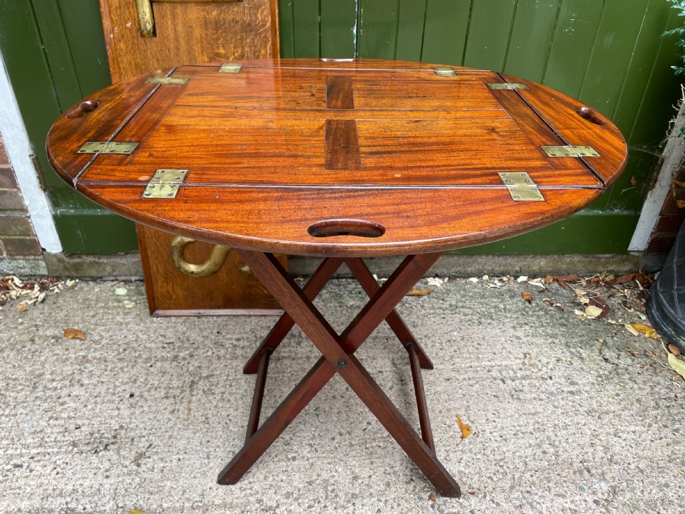 Late C18th George III period hinged and folding-sided oval mahogany butler’s tray and stand .