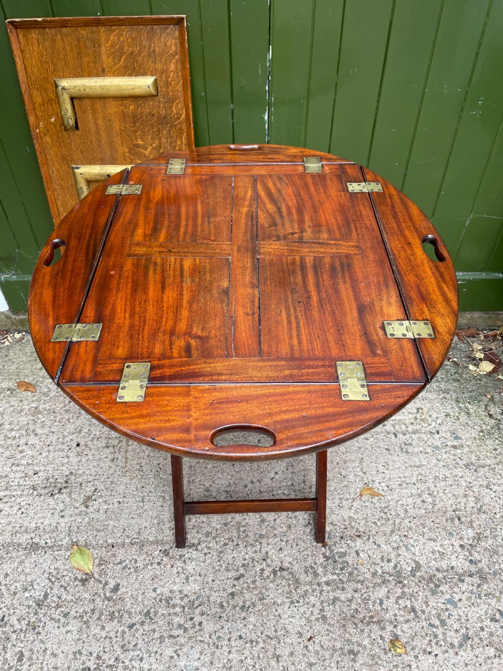 Late C18th George III period hinged and folding-sided oval mahogany butler’s tray and stand . View IX