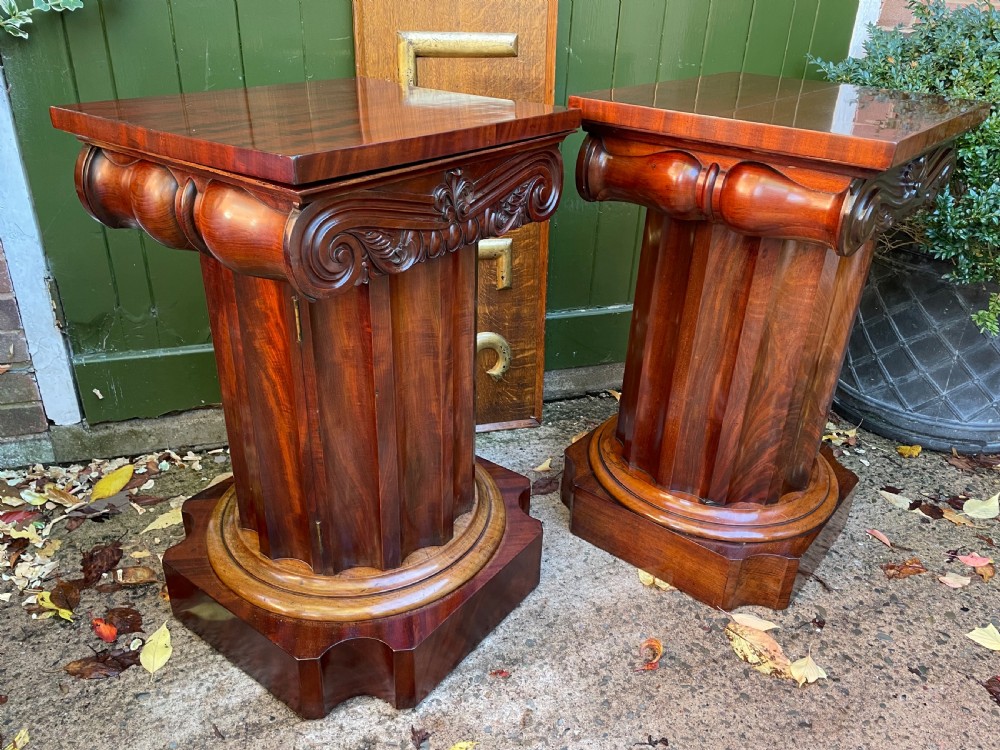A matched pair of William IV mahogany pedestals designed in classical ionic column form with fluted shafts and stepped bases. View III