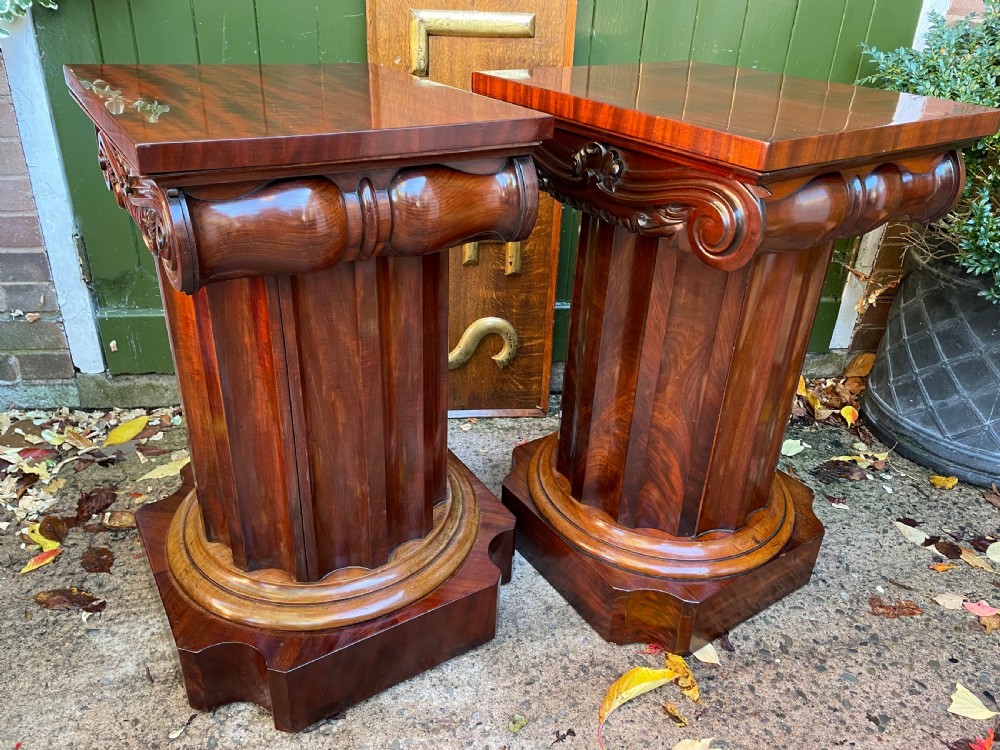 A matched pair of William IV mahogany pedestals designed in classical ionic column form with fluted shafts and stepped bases. View XIV