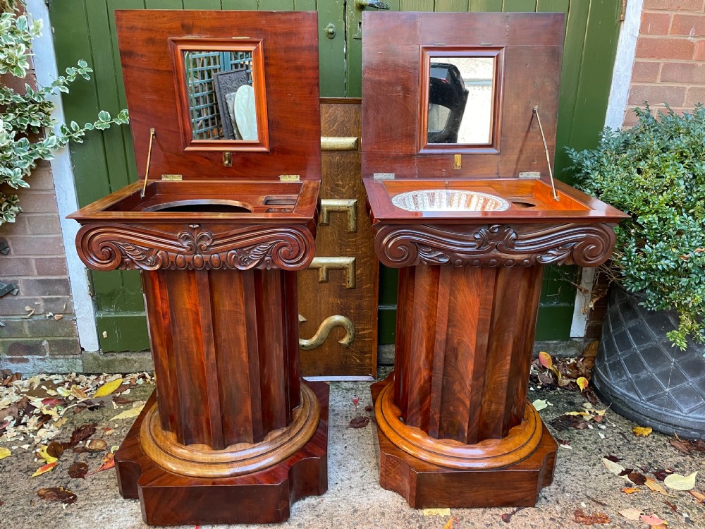 A matched pair of William IV mahogany pedestals designed in classical ionic column form with fluted shafts and stepped bases. View XV