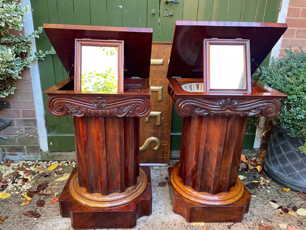 A matched pair of William IV mahogany pedestals designed in classical ionic column form with fluted shafts and stepped bases. View XVI