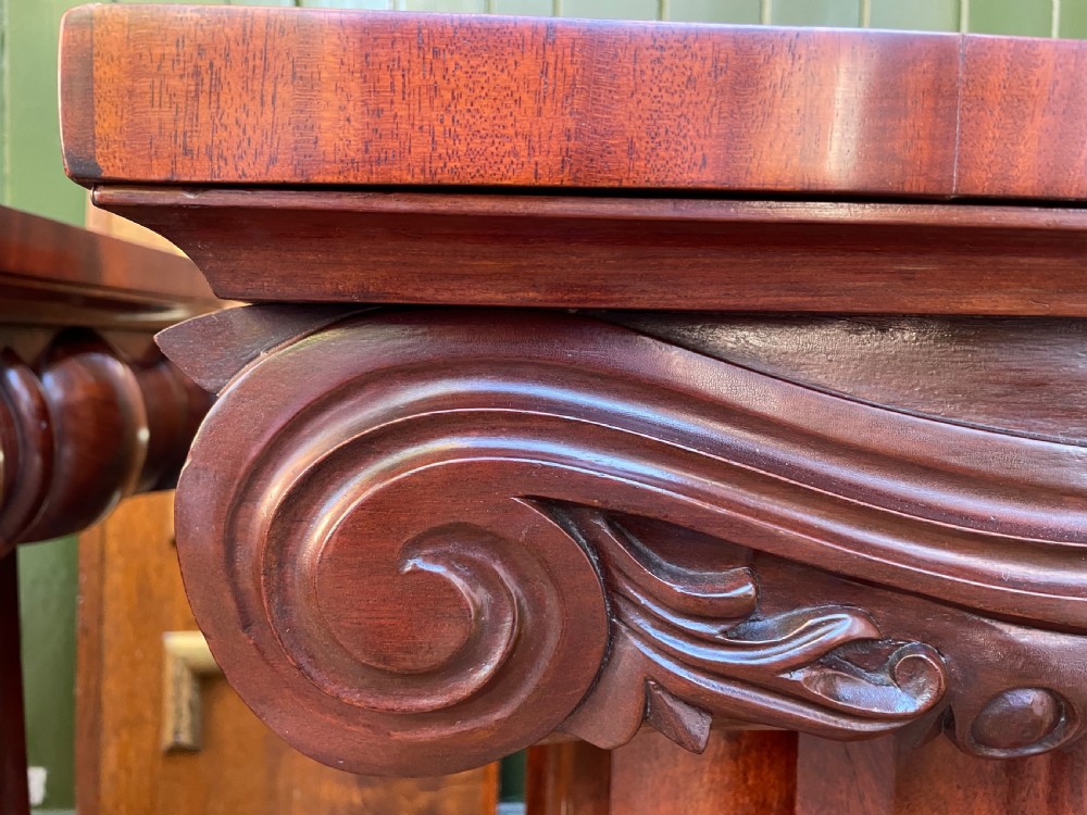 A matched pair of William IV mahogany pedestals designed in classical ionic column form with fluted shafts and stepped bases. View XVIII