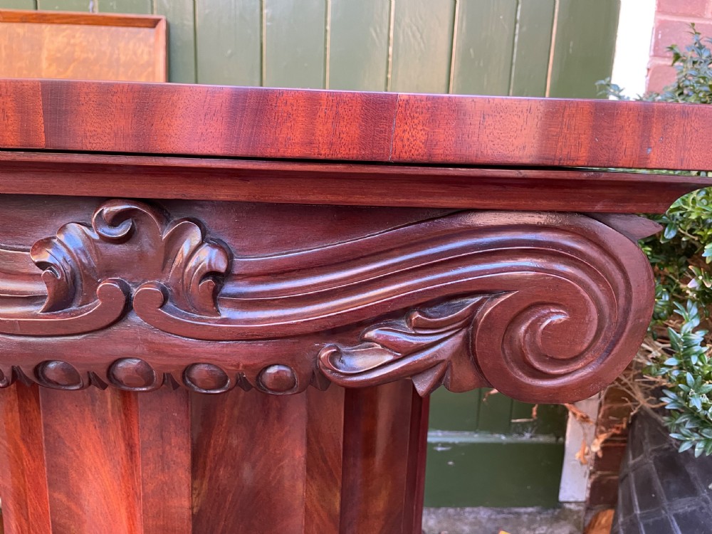 A matched pair of William IV mahogany pedestals designed in classical ionic column form with fluted shafts and stepped bases. View XIX