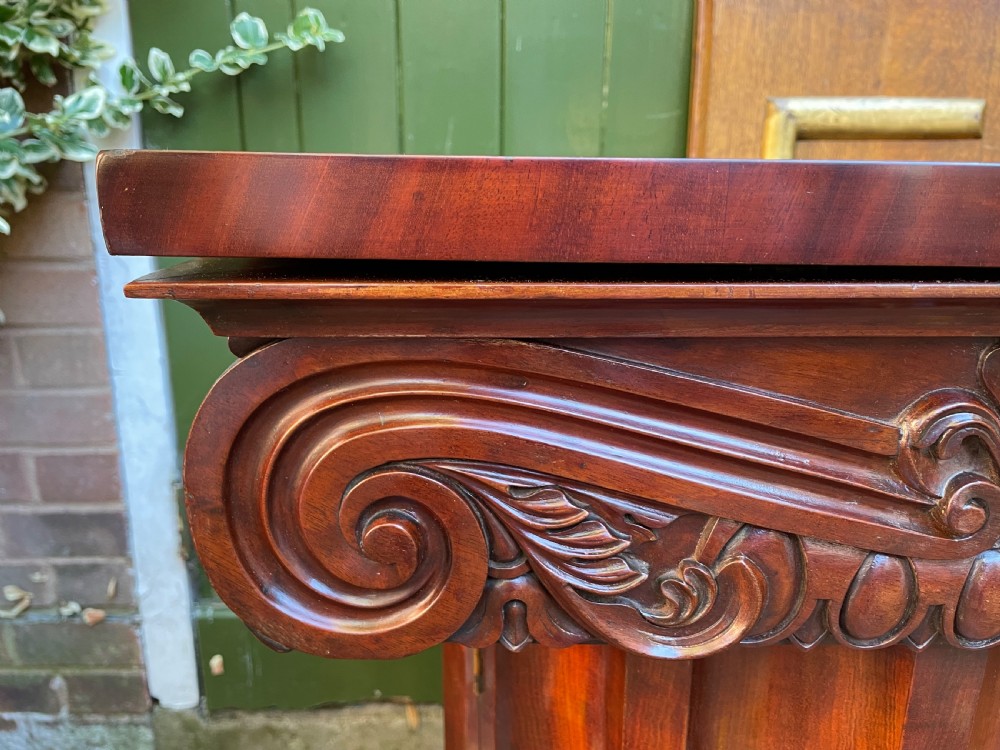 A matched pair of William IV mahogany pedestals designed in classical ionic column form with fluted shafts and stepped bases. View XX