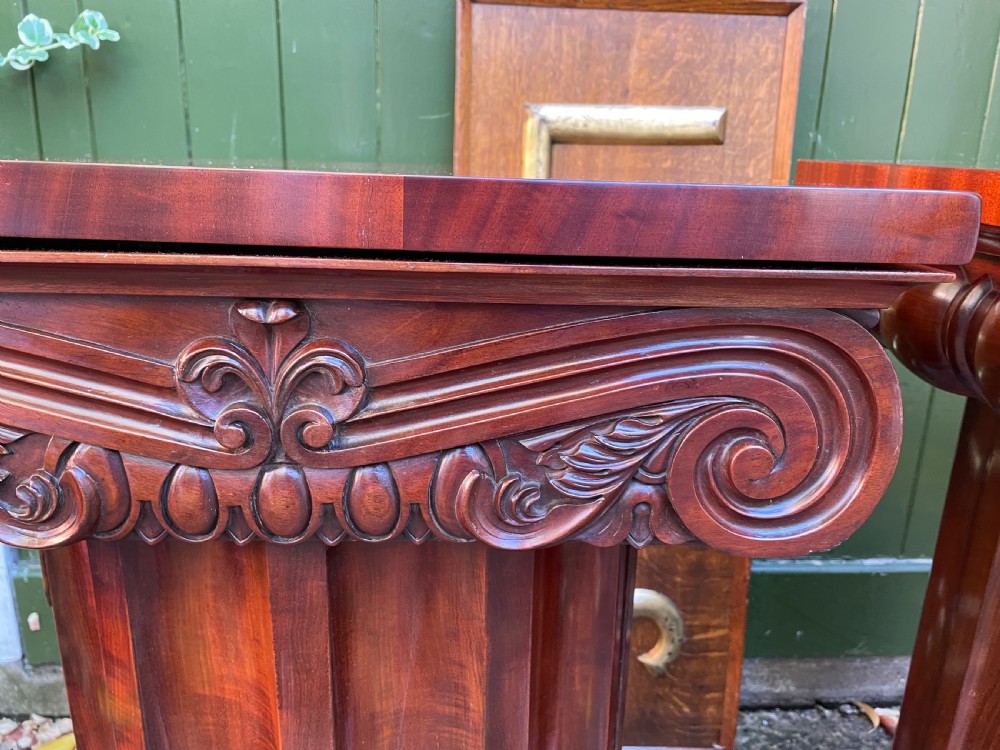 A matched pair of William IV mahogany pedestals designed in classical ionic column form with fluted shafts and stepped bases. View XXI