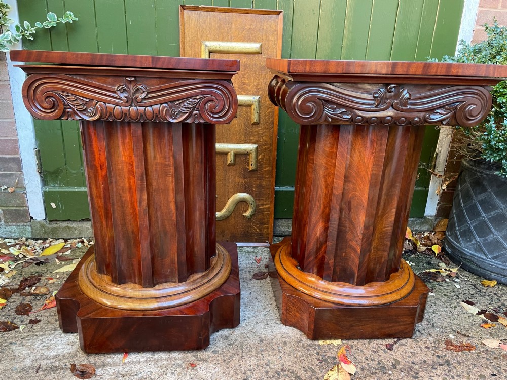 A matched pair of William IV mahogany pedestals designed in classical ionic column form with fluted shafts and stepped bases. View XXIII