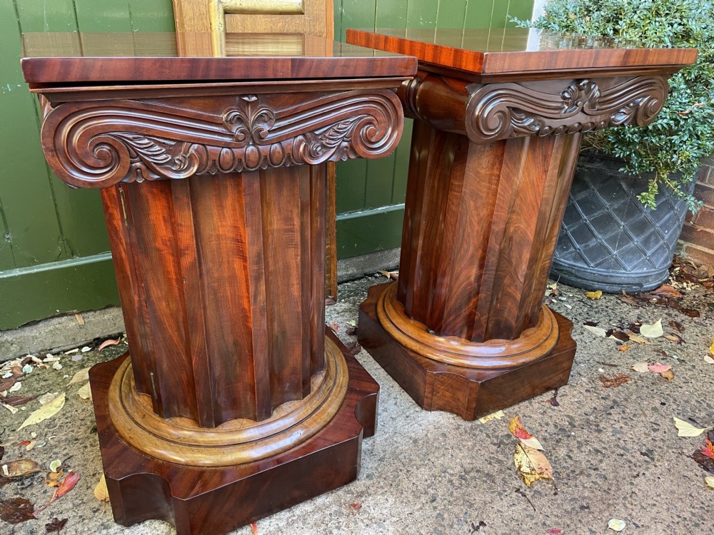 A matched pair of William IV mahogany pedestals designed in classical ionic column form with fluted shafts and stepped bases. View XXVII
