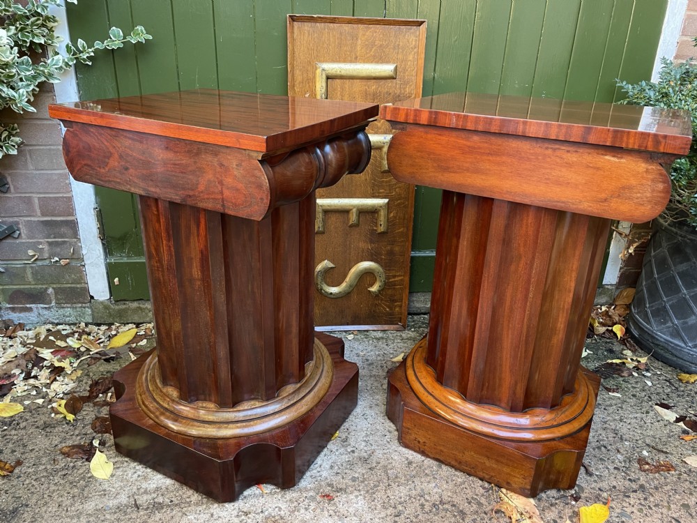 A matched pair of William IV mahogany pedestals designed in classical ionic column form with fluted shafts and stepped bases. View XXVIII