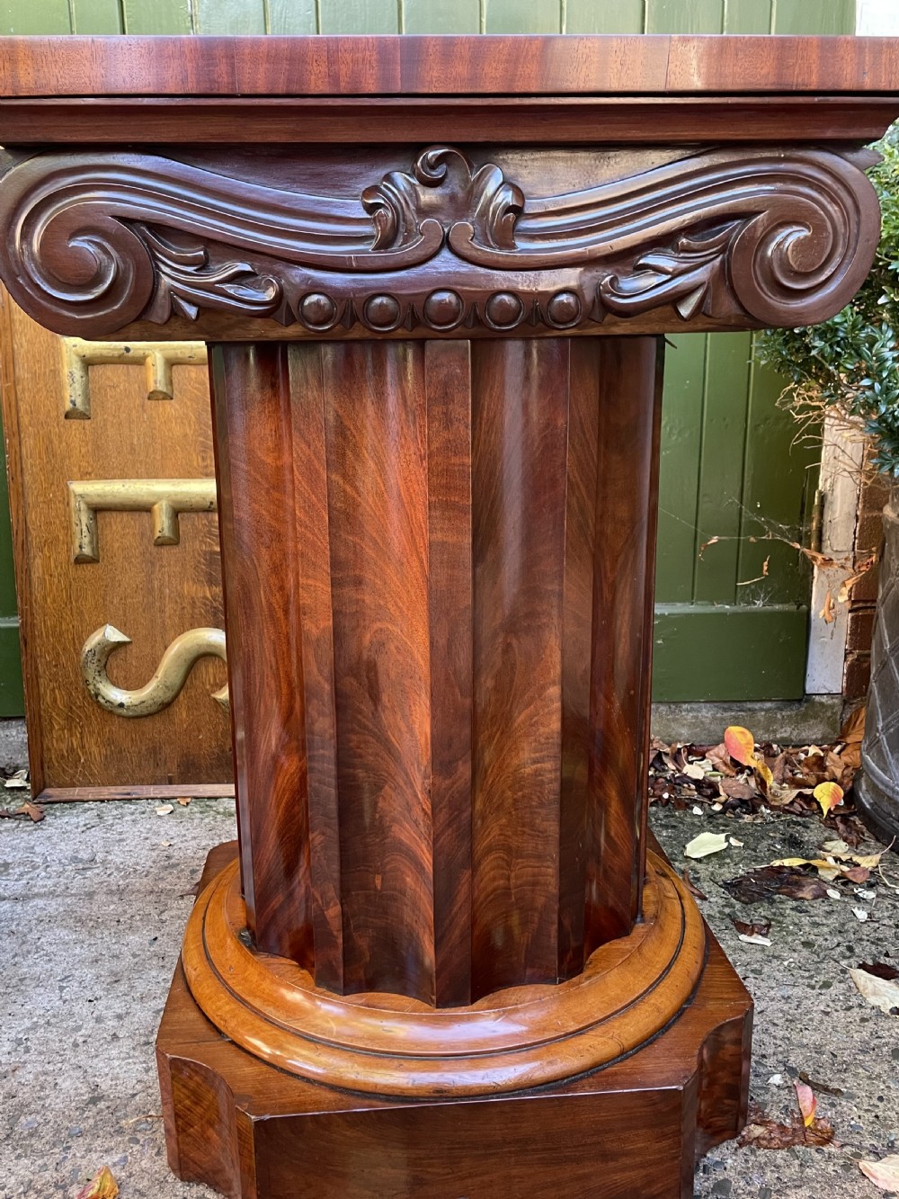 A matched pair of William IV mahogany pedestals designed in classical ionic column form with fluted shafts and stepped bases. View XXIX