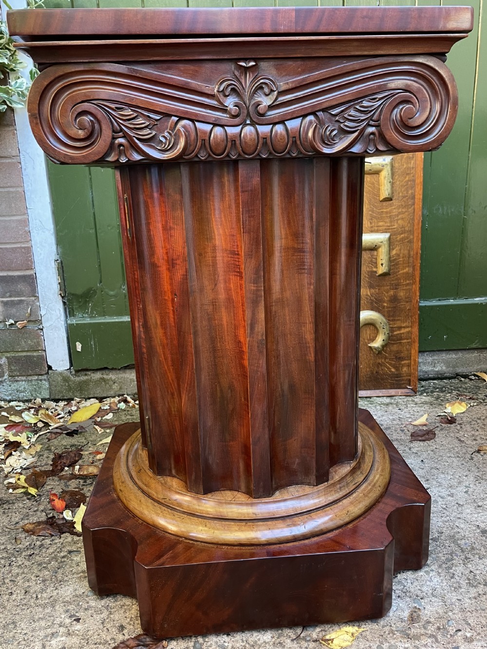 A matched pair of William IV mahogany pedestals designed in classical ionic column form with fluted shafts and stepped bases. View XXX