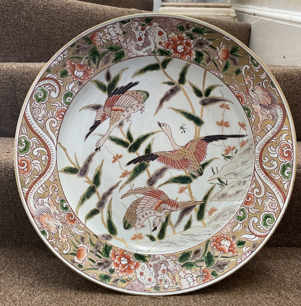 C19th dished porcelain charger in the early C18th Japanese Imari style by Samson. View XX