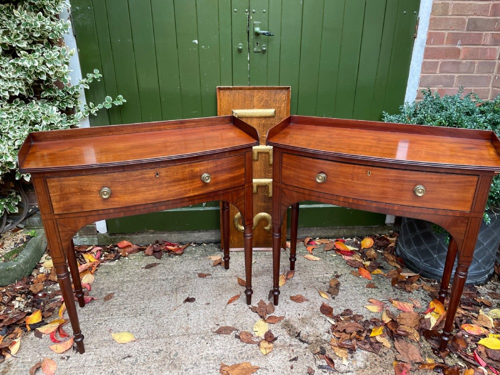 Pair of elegant early C19th late George III period mahogany bow-front side tables . View II