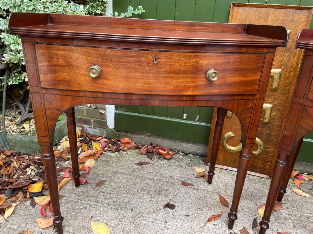 Pair of elegant early C19th late George III period mahogany bow-front side tables . View IV