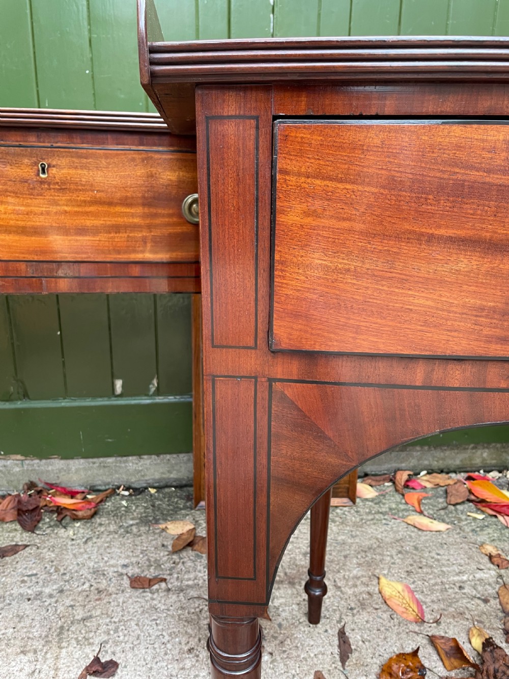 Pair of elegant early C19th late George III period mahogany bow-front side tables . View X
