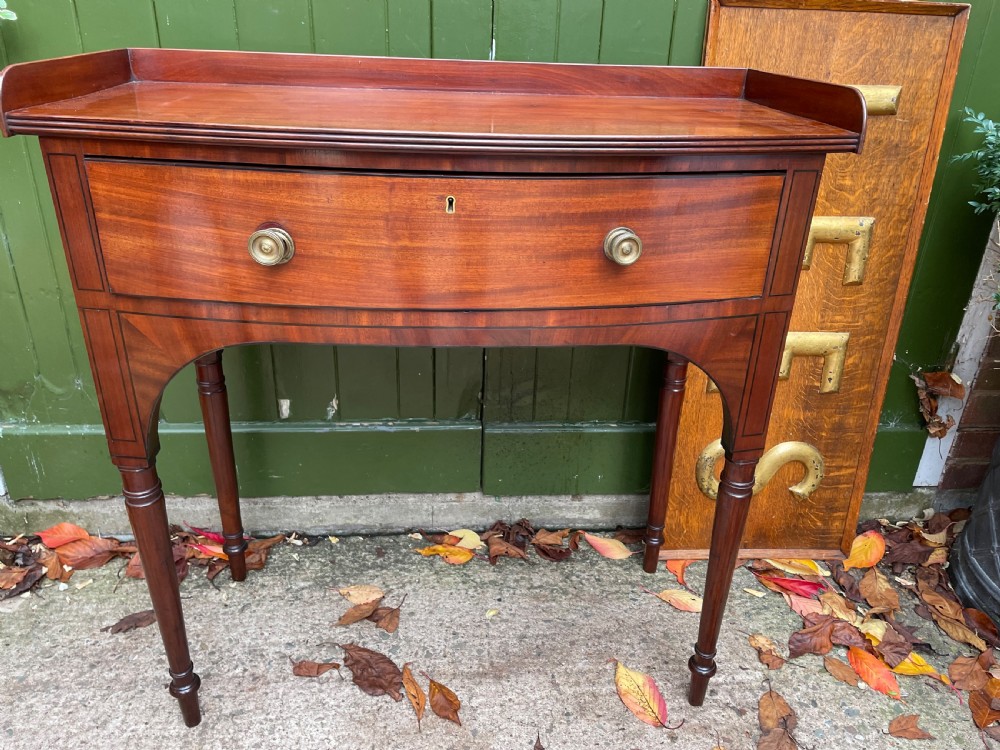 Pair of elegant early C19th late George III period mahogany bow-front side tables . View XX