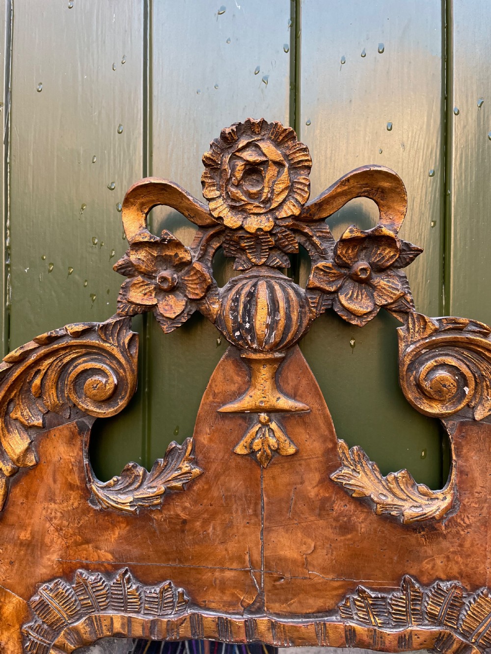 A pair of late nineteenth century carved walnut and parcel-gilt wall consoles with matching arch-top mirrors featuring urn and floral cresting. View XII