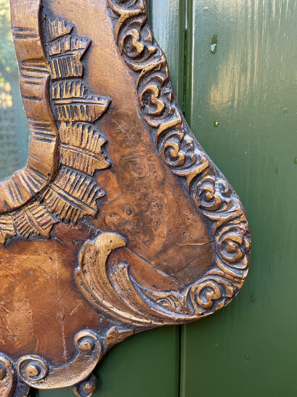 A pair of late nineteenth century carved walnut and parcel-gilt wall consoles with matching arch-top mirrors featuring urn and floral cresting. View XIII