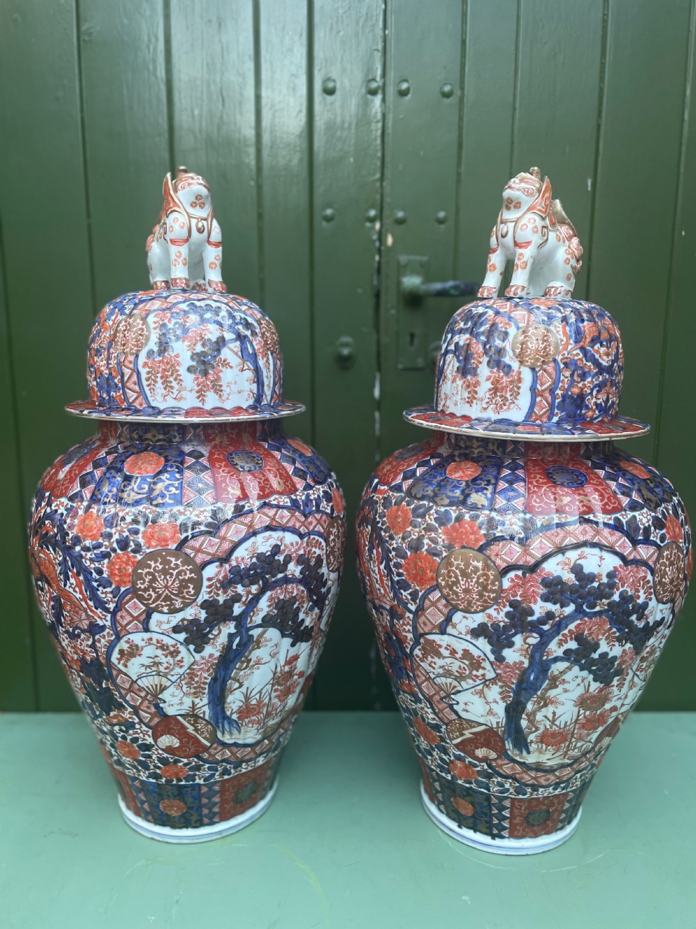 Fine large pair of mid C19th Japanese Imari porcelain vases and covers .