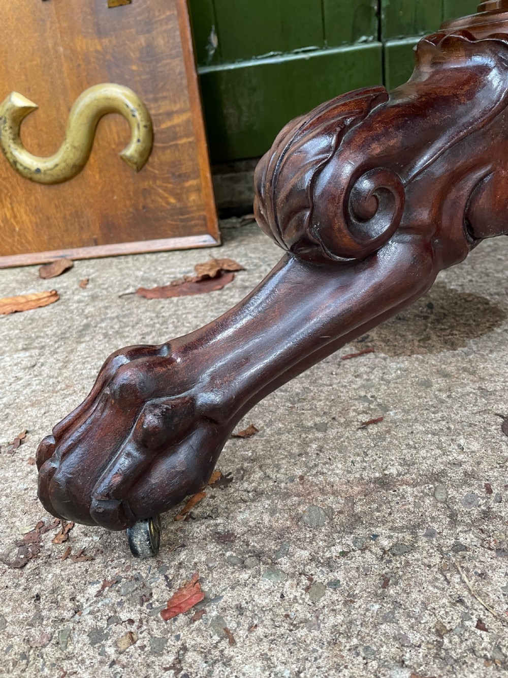 An early nineteenth-century French Charles X mahogany gueridon table featuring a circular grey marble top set upon a fluted pedestal stem and scrolled tripod feet. View III