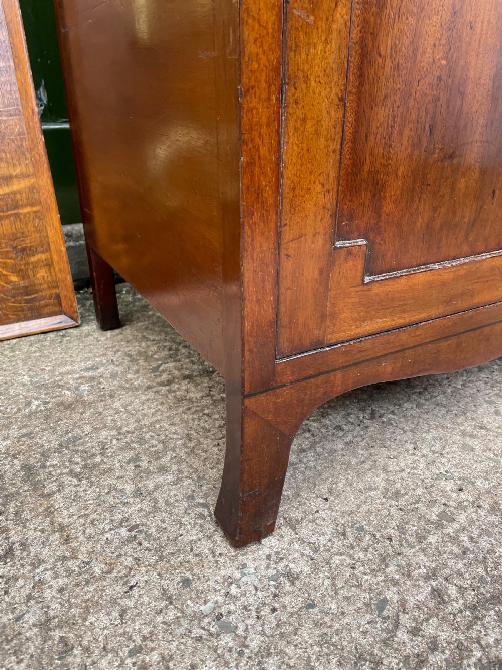 A tall late eighteenth-century George III mahogany etagere featuring open shelves, turned column supports, two drawers, and a lower enclosed cupboard. View XV