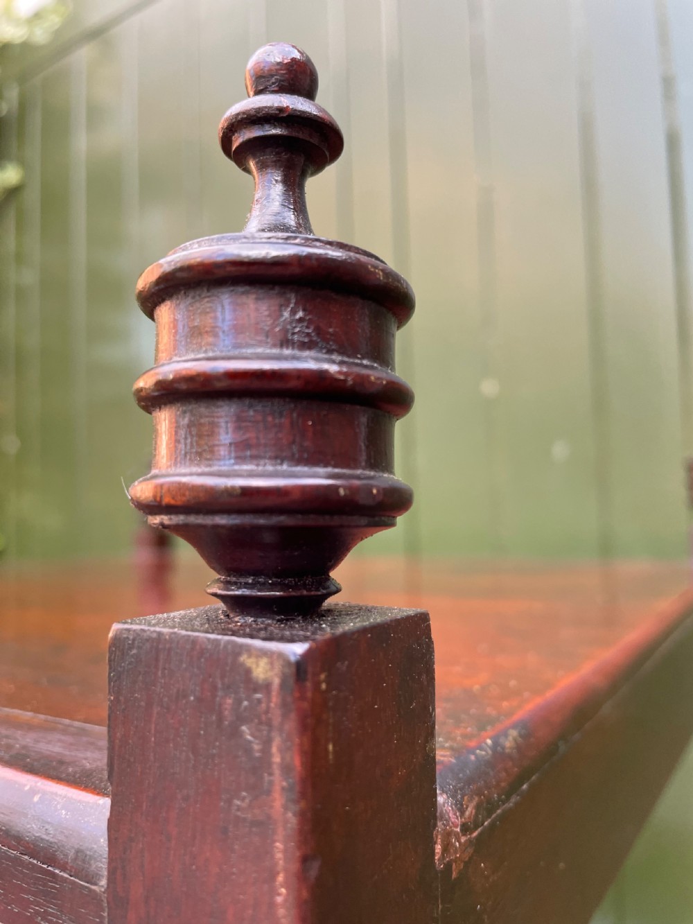 A tall late eighteenth-century George III mahogany etagere featuring open shelves, turned column supports, two drawers, and a lower enclosed cupboard. View XXII