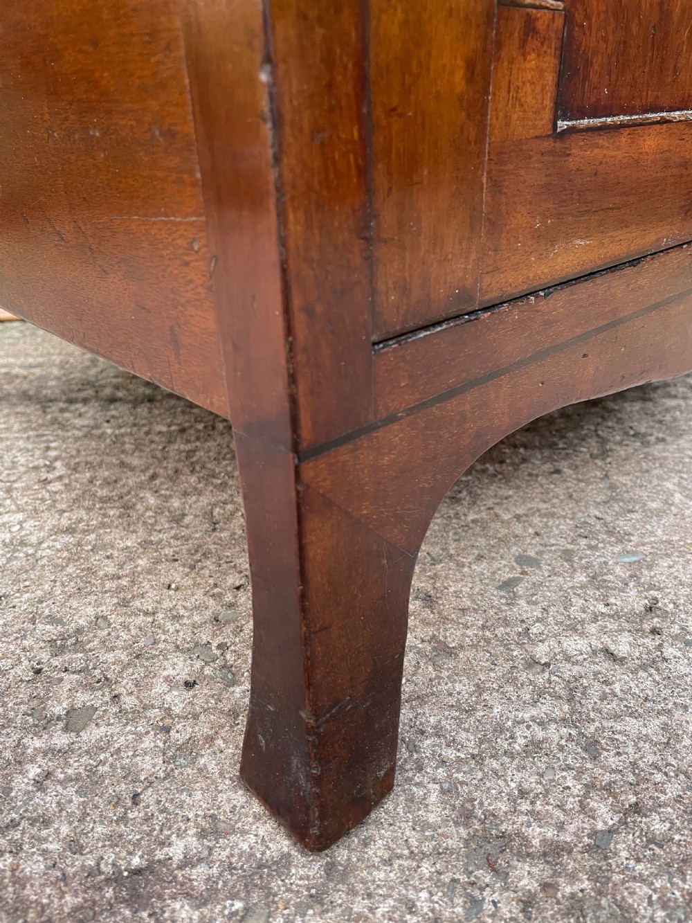 A tall late eighteenth-century George III mahogany etagere featuring open shelves, turned column supports, two drawers, and a lower enclosed cupboard. View XXIII