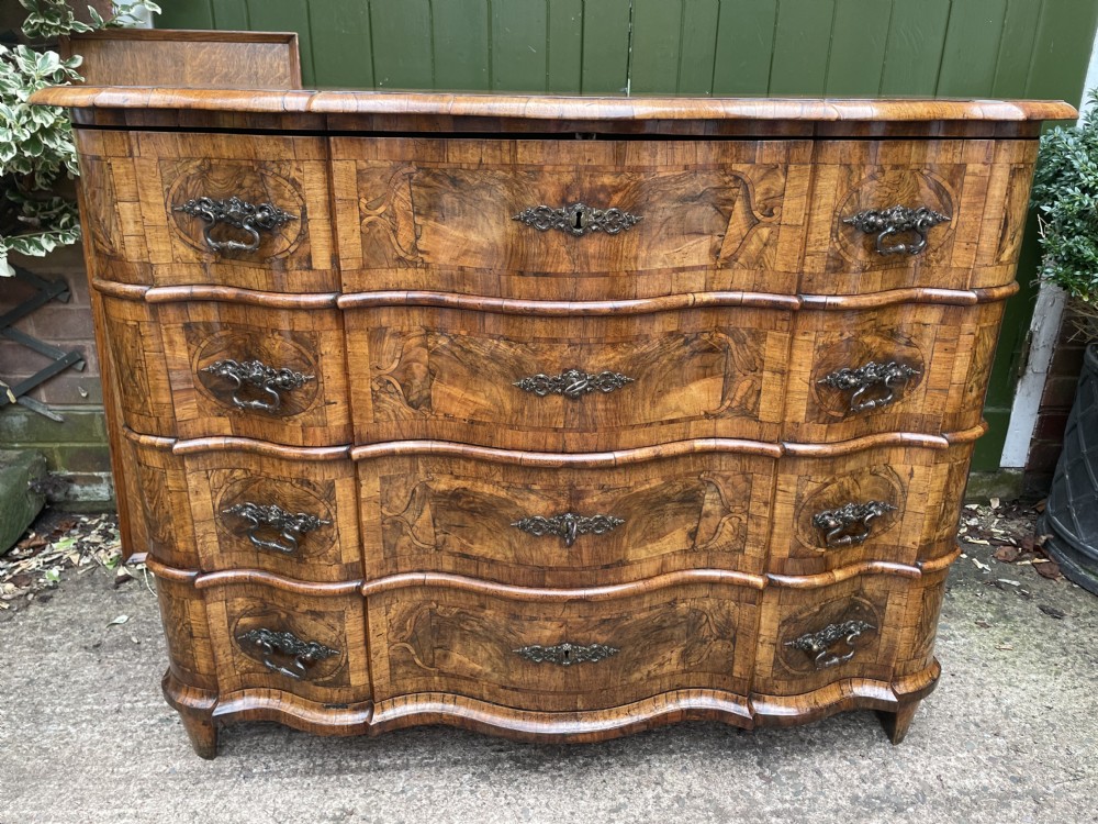 Mid C18th German serpentine outline walnut baroque period commode.