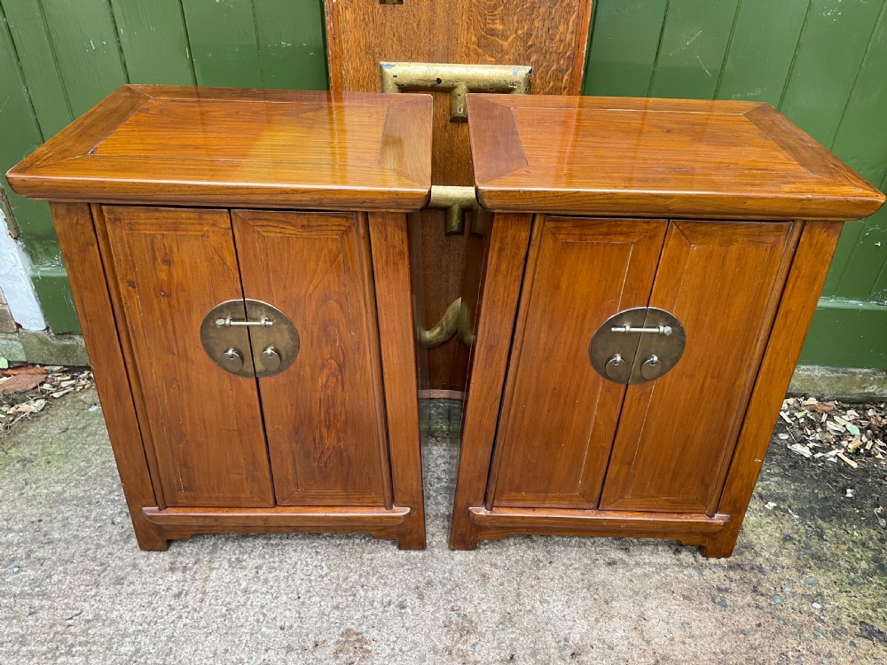 Pair of early C20th Chinese Republic period hardwood bedside cupboards. View II