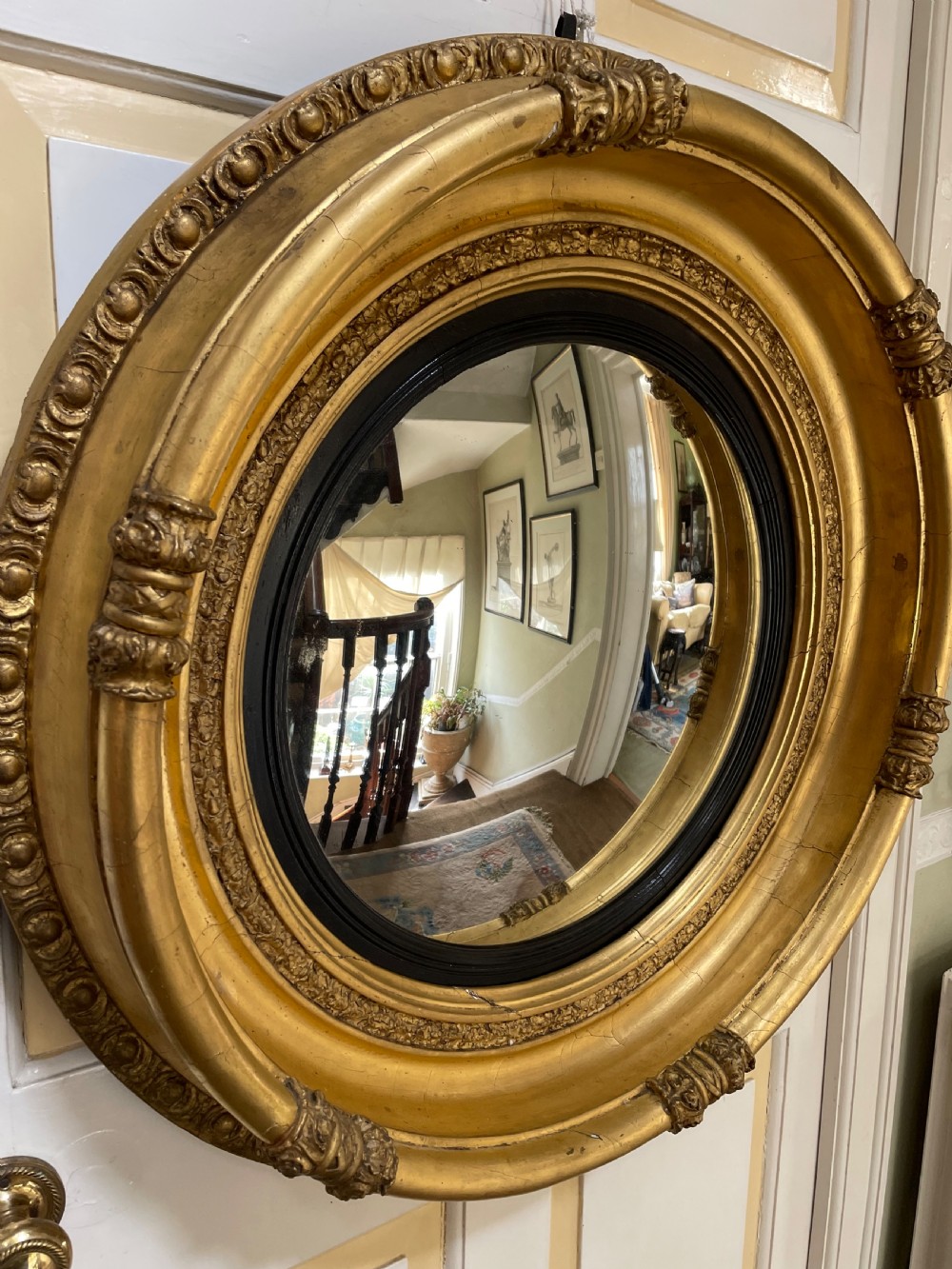 Large early C19th Regency period carved gilt-wood frame convex plate mirror  View IX