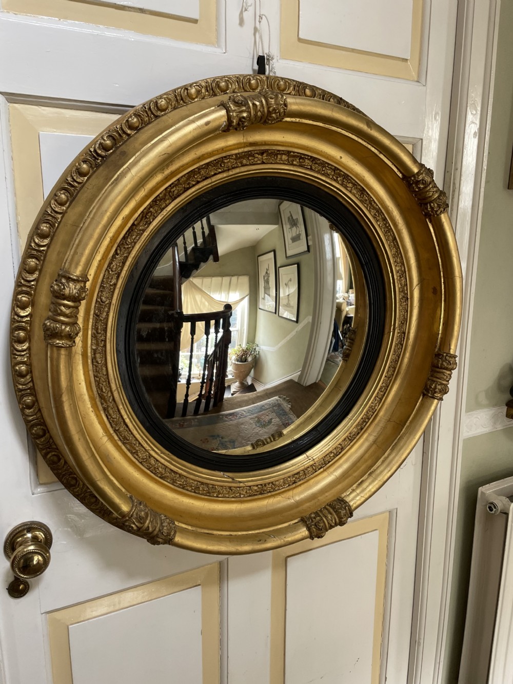 Large early C19th Regency period carved gilt-wood frame convex plate mirror  View II