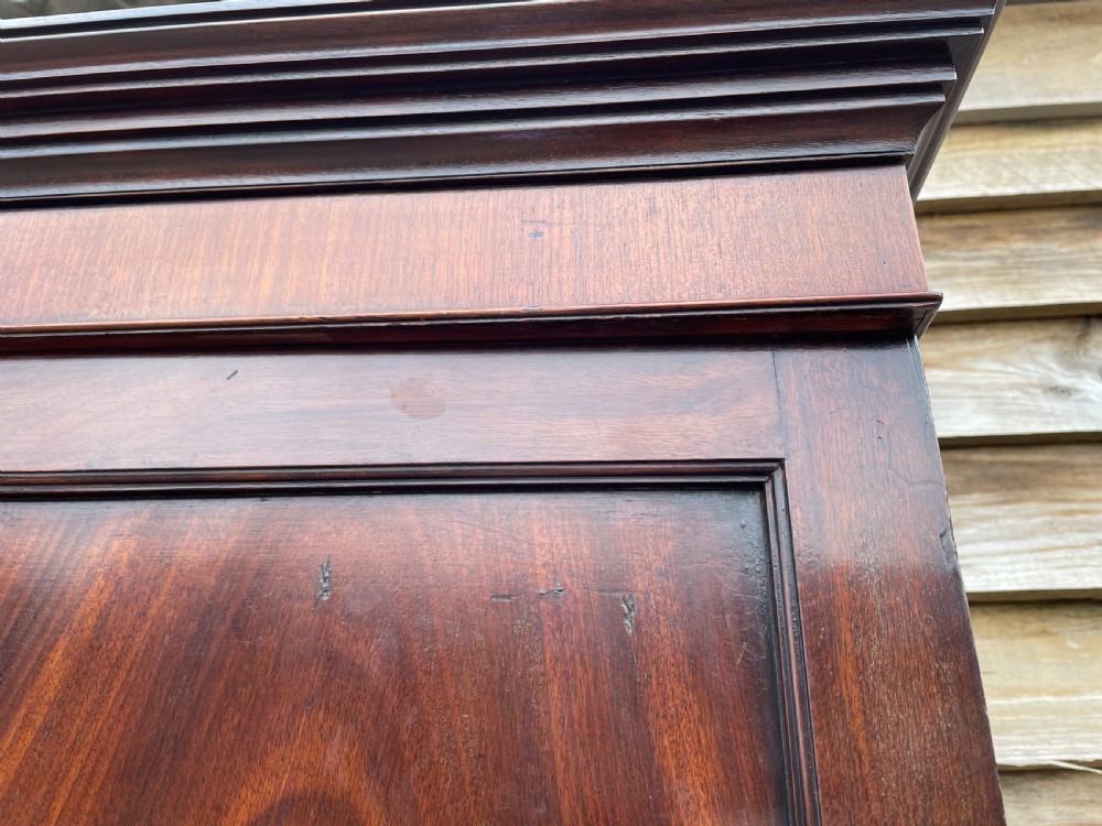 A late eighteenth-century George III mahogany estate cabinet featuring upper panel doors above drawers with gilded alphabetical lettering. View XXIX