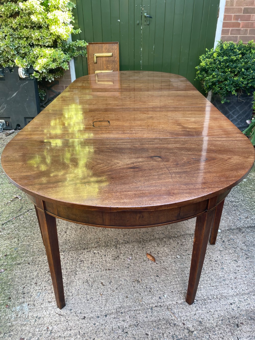 Late C18th George III period mahogany d-end dining table of highly versatile format.
