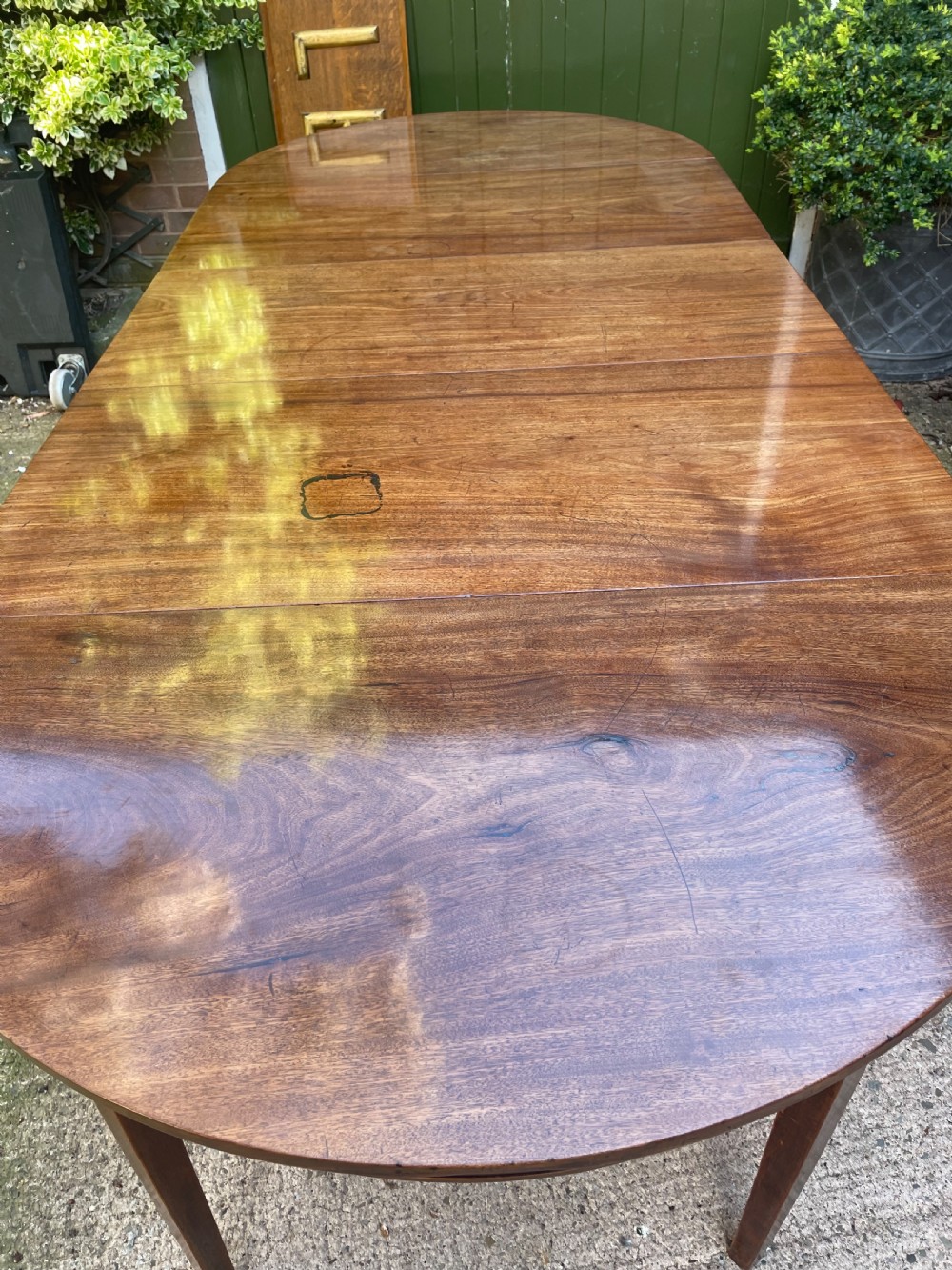 Late C18th George III period mahogany d-end dining table of highly versatile format. View III