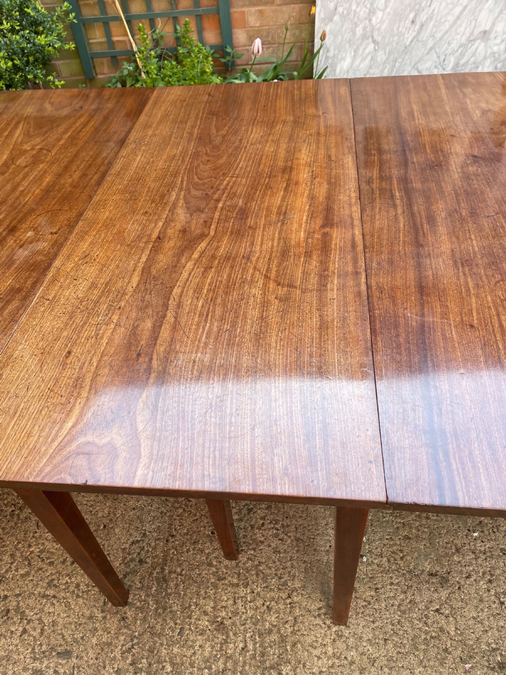 Late C18th George III period mahogany d-end dining table of highly versatile format. View X