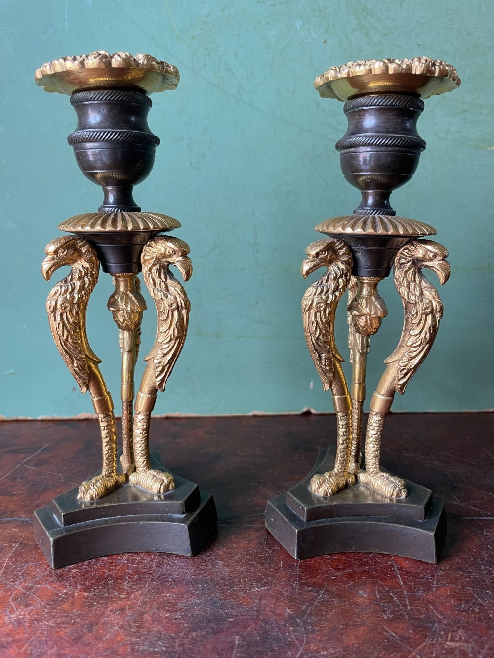 Pair of high quality early C19th Regency period patinated bronze and ormolu candlesticks.