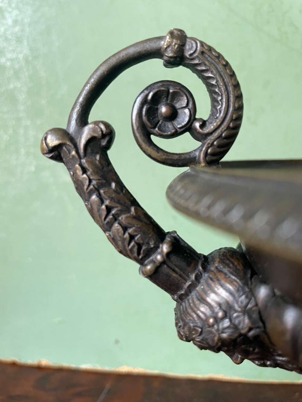 A pair of 19th-century dark bronze tazzas featuring gadrooned bowls and scroll handles, each mounted on a square red mottled marble base. View XXIV