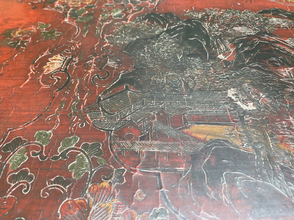 A late nineteenth-century Chinese red lacquered altar table featuring carved decorative spandrels and a patinated surface. View X