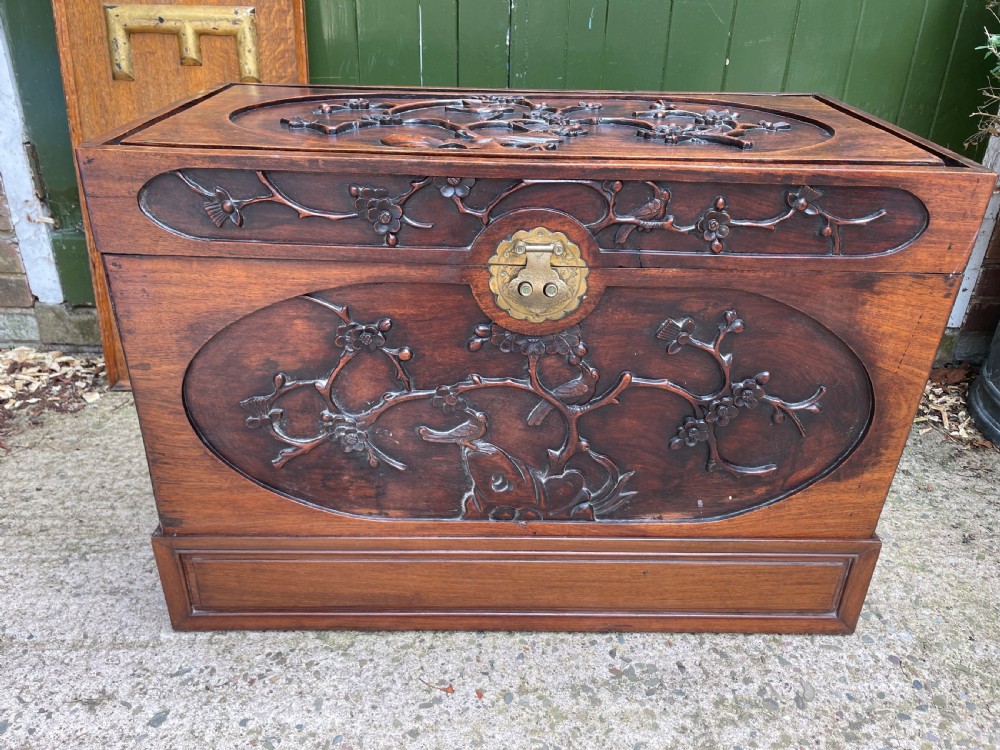 Late C19th Chinese Qing Dynasty carved hardwood trunk on stand.