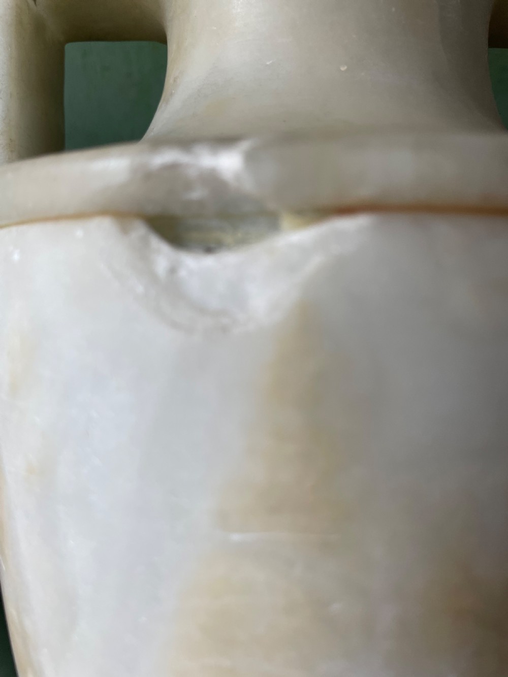 A pair of early nineteenth-century carved cream alabaster classical urns with lids, angular side handles, and square pedestal bases. View VIII