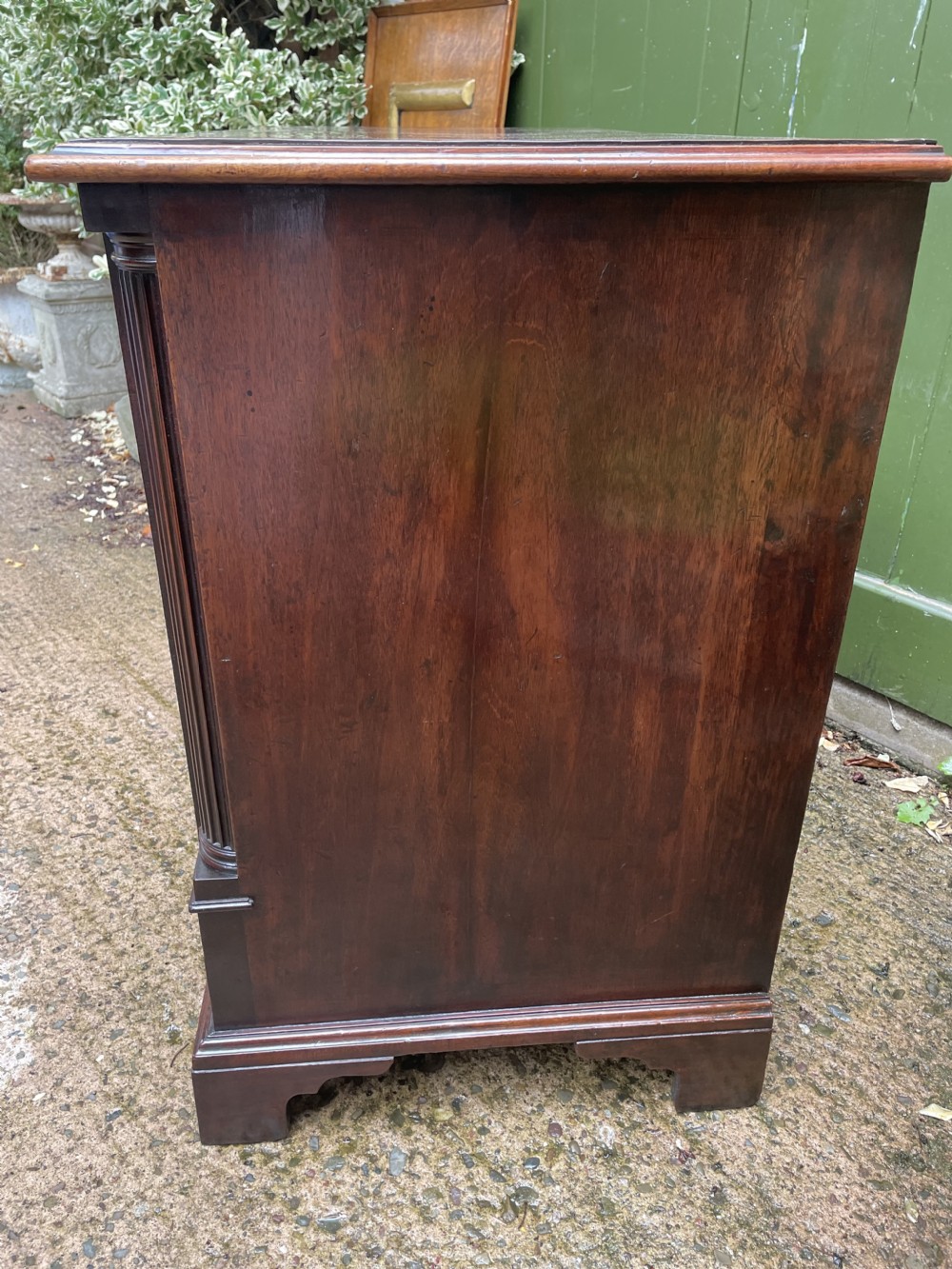 A mid-18th century George III mahogany chest of drawers featuring a two over three drawer layout with brass handles and bracket feet. View XIX