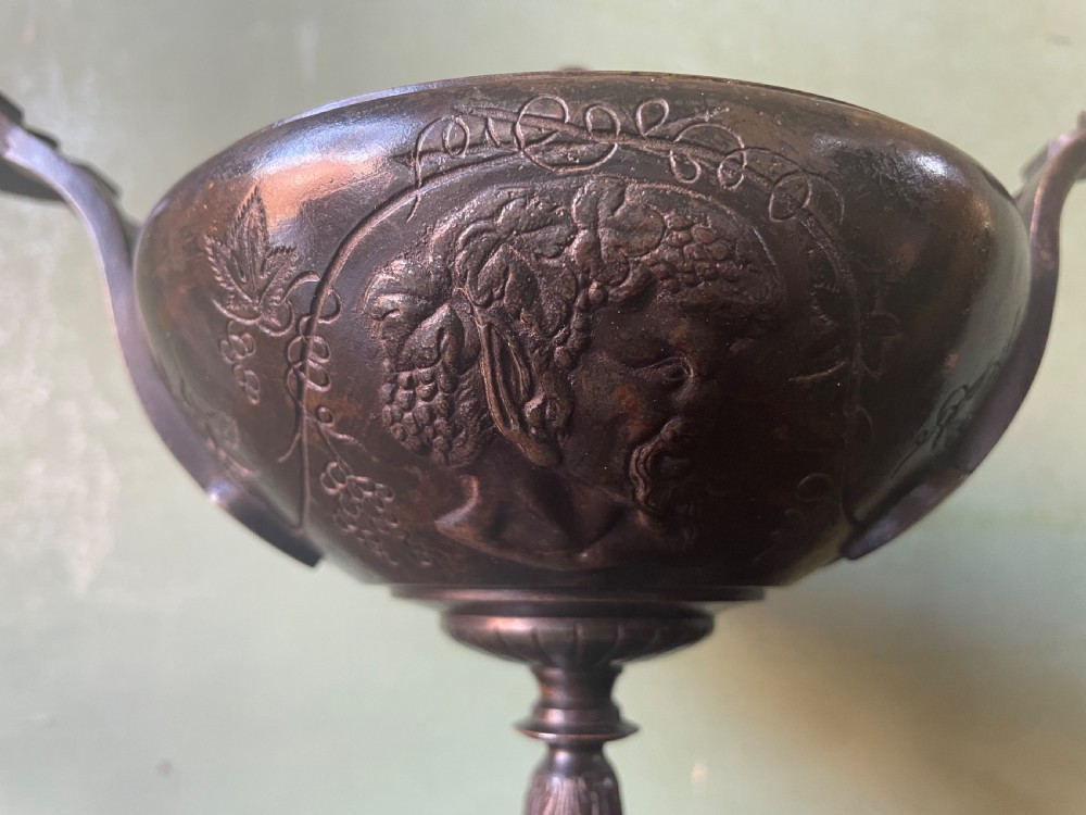 A nineteenth-century bronze lidded tazza featuring Greek key chasing and elevated handles, supported by a round red marble base. View IX