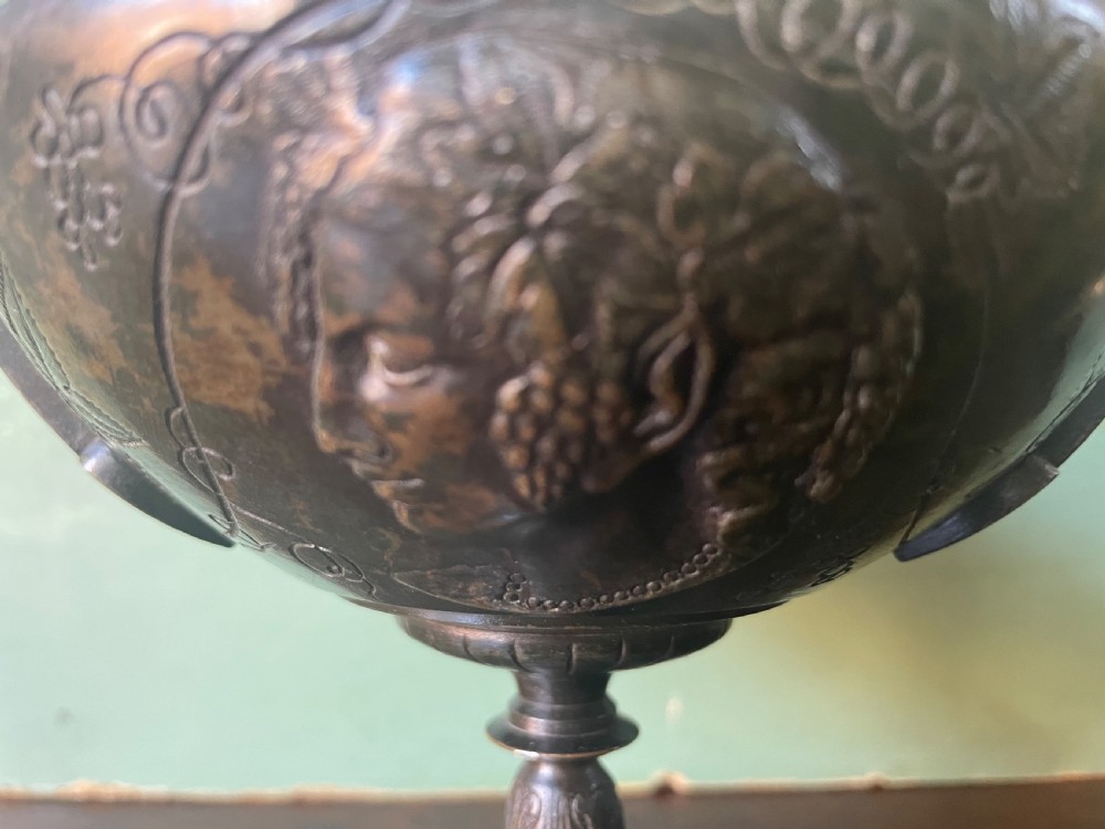 A nineteenth-century bronze lidded tazza featuring Greek key chasing and elevated handles, supported by a round red marble base. View XIV