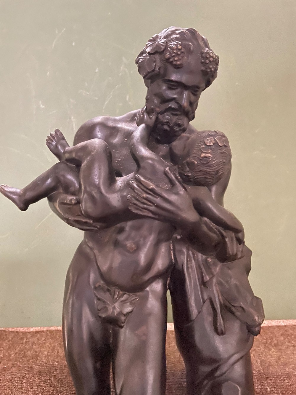 Large mid C19th Italian ‘Grand Tour’ souvenir bronze sculpture, after the antique, of Silenus cradling the Infant Bacchus. View III
