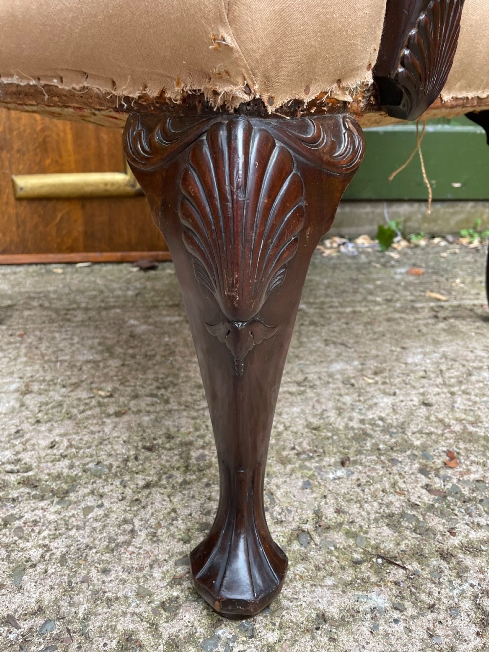 A mid-nineteenth-century carved mahogany Gainsborough armchair upholstered in neutral fabric with carved cabriole legs and claw and ball feet. View XIV