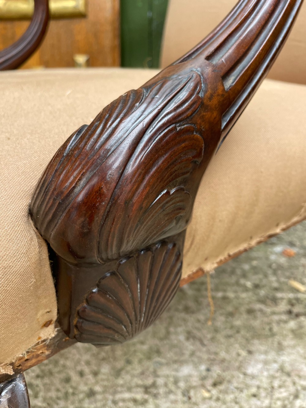 A mid-nineteenth-century carved mahogany Gainsborough armchair upholstered in neutral fabric with carved cabriole legs and claw and ball feet. View XVIII