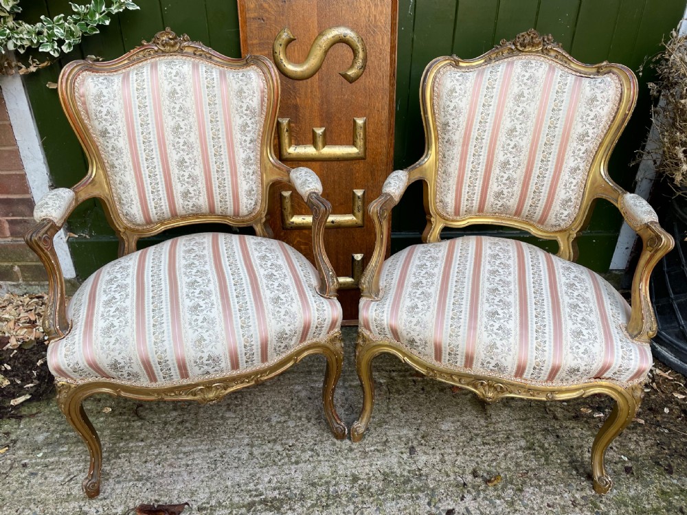 Elegant pair of late C19th French carved gilt-wood salon armchairs in the C18th Louis XVI period rococo style.